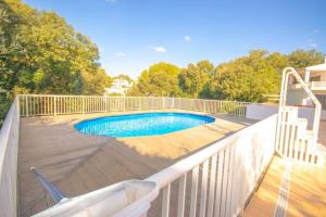 a swimming pool on the deck of a house at Villa Garbes in Cala Galdana