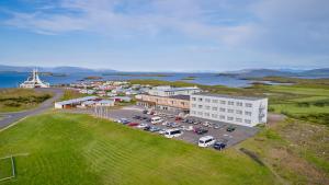 an aerial view of a parking lot in front of a building at Fosshotel Stykkisholmur in Stykkishólmur
