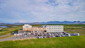 an aerial view of a building with a parking lot at Fosshotel Stykkisholmur in Stykkishólmur