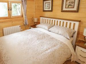 Postel nebo postele na pokoji v ubytování Port Heron Lodge