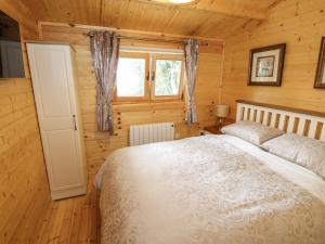 Postel nebo postele na pokoji v ubytování Port Heron Lodge