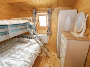 Postel nebo postele na pokoji v ubytování Port Heron Lodge
