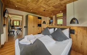 a bedroom with a large white bed in a room at Chalet Wallehen in Saalbach Hinterglemm