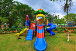 a group of playground equipment in a park at White Feather Resort Kauncha in Silvassa