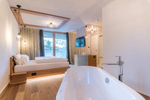 Voodi või voodid majutusasutuse Hotel Tofana toas