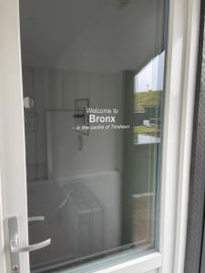 a window with a welcome to bronx in the corner of a room at Bronx in the Centre of Tórshavn in Tórshavn