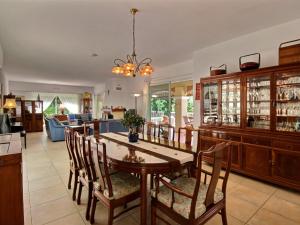a kitchen and dining room with a table and chairs at Villa Bois Doré in Valbonne
