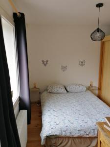 Postel nebo postele na pokoji v ubytování chez mimie