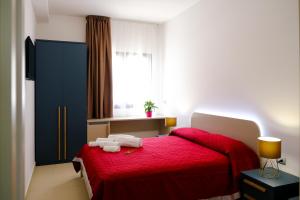Säng eller sängar i ett rum på SOL Y MAR Camere e Appartamenti