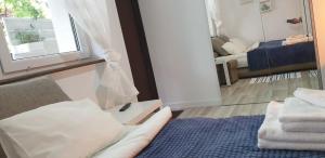 Postel nebo postele na pokoji v ubytování Dom Przy Plaży