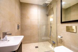 a bathroom with a sink and a shower at Piccadilly Place in York