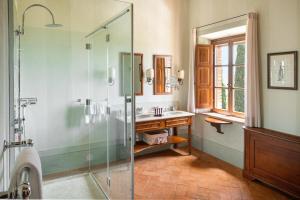 a bathroom with a shower and a sink at Castello Banfi - Il Borgo in Montalcino