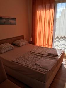 Postel nebo postele na pokoji v ubytování Family Hotel Astra