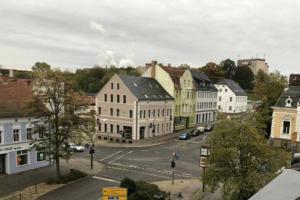an aerial view of a town with buildings and a street at Ferienwohnung im alten Waschhaus in Spremberg
