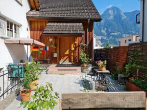 a house with a patio with a mountain in the background at Chalet Ferreira in Weite