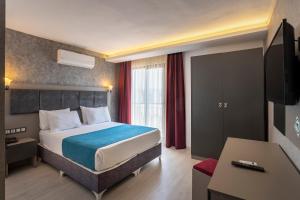 Кровать или кровати в номере TAMARA Business Otel