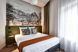 Postel nebo postele na pokoji v ubytování Urban Yard Hotel