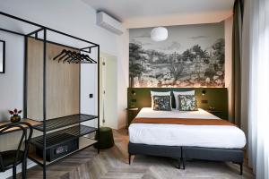 Postel nebo postele na pokoji v ubytování Urban Yard Hotel