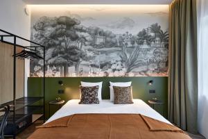 Postel nebo postele na pokoji v ubytování Urban Yard Hotel