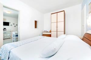 Postel nebo postele na pokoji v ubytování Apartment Casa Banko