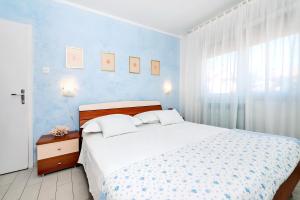 Postel nebo postele na pokoji v ubytování Apartment Casa Banko