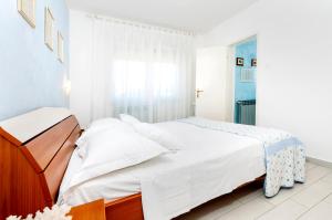 Postel nebo postele na pokoji v ubytování Apartment Casa Banko