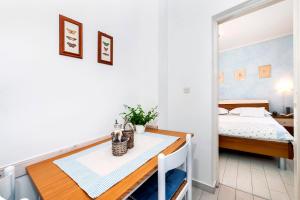 Postel nebo postele na pokoji v ubytování Apartment Casa Banko