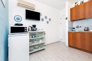 Kuchyň nebo kuchyňský kout v ubytování Apartment Casa Banko