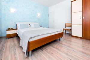 Postel nebo postele na pokoji v ubytování Apartment Casa Banko