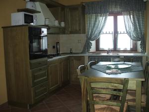 Kuchyň nebo kuchyňský kout v ubytování Agriturismo il Tiglio