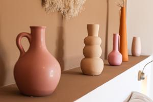 a group of vases sitting on a counter at Chambre d'hôtes A Vadina Porticcio in Porticcio