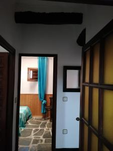 Posteľ alebo postele v izbe v ubytovaní Casa Rural Arcoiris