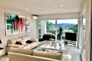 A seating area at Villa Olympia Pool Sea View Mountains Lake Nature Sleeps 8 Air Conditioning Wi-Fi