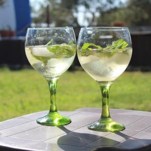 two wine glasses sitting on top of a table at Quinta do Freixo in Reguengos de Monsaraz