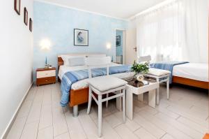 Postel nebo postele na pokoji v ubytování Apartment Casa Banko