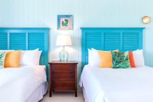 Postel nebo postele na pokoji v ubytování Boardwalk Boutique Hotel Aruba - Adults Only