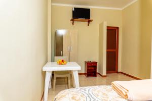 TV a/nebo společenská místnost v ubytování Cucuve Eco Hostal