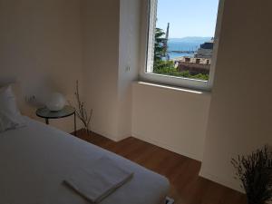 Posteľ alebo postele v izbe v ubytovaní Marina Rijeka Center apartments