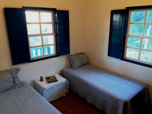Säng eller sängar i ett rum på Sítio São Francisco - Um Refúgio Off-Road no Alto da Serra da Mantiqueira