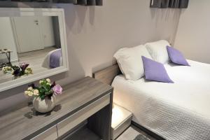 Posteľ alebo postele v izbe v ubytovaní Apartments & Rooms Lavandula Exclusive