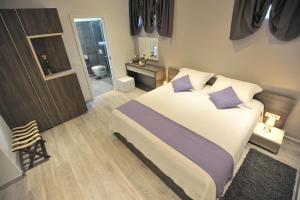 Posteľ alebo postele v izbe v ubytovaní Apartments & Rooms Lavandula Exclusive