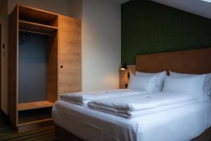 Ένα ή περισσότερα κρεβάτια σε δωμάτιο στο Kb Hotel