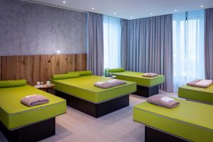 Ένα ή περισσότερα κρεβάτια σε δωμάτιο στο Kb Hotel