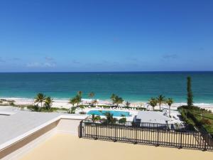 a view of the beach from the balcony of a resort at The Lookout at Coral Beach in Freeport