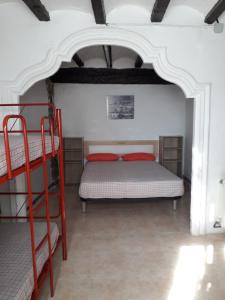 Llit o llits en una habitació de Albergue Rural Cal Picarol