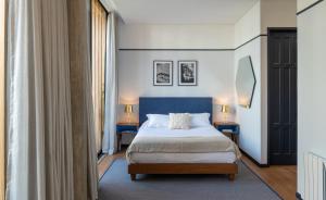 Ένα ή περισσότερα κρεβάτια σε δωμάτιο στο HAB Hotel Bogotá +41 φωτογραφίες