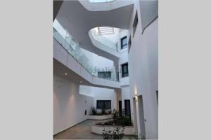 an image of a building with a spiral staircase at Apartamento de lujo con piscina en Tarifa in Tarifa