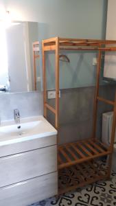 a bathroom with a sink and a bunk bed at le Chartreuse / Rent4night Grenoble in Grenoble +16 photos