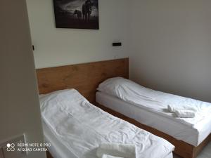 Postel nebo postele na pokoji v ubytování Hotel Konopielka