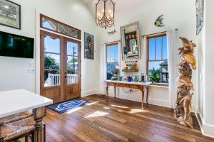 a home office with a desk and windows at de la Bleau B&B in Mandeville